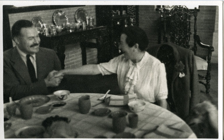 Hemingway at Table with Woman